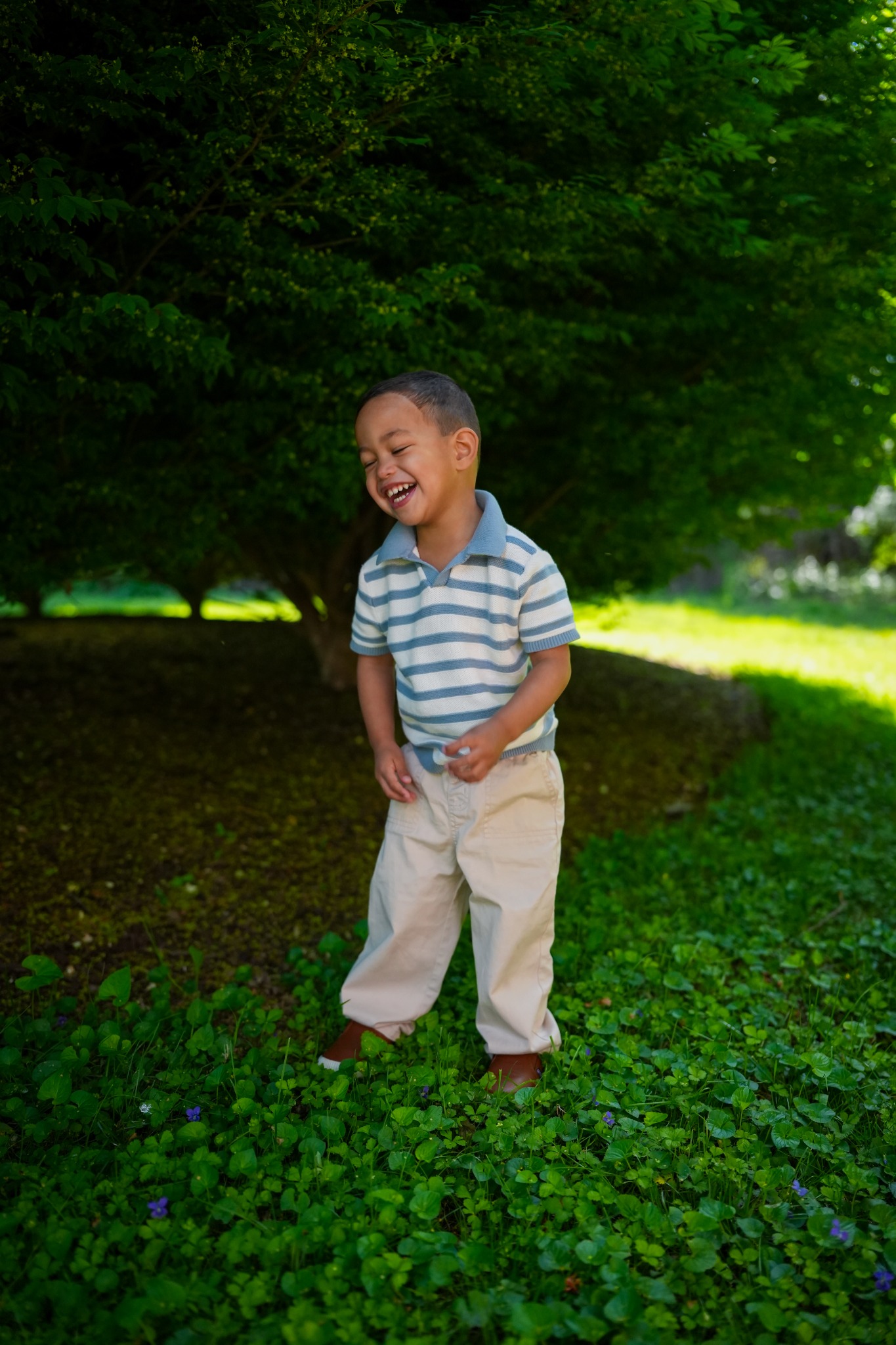 Child laughing outdoors